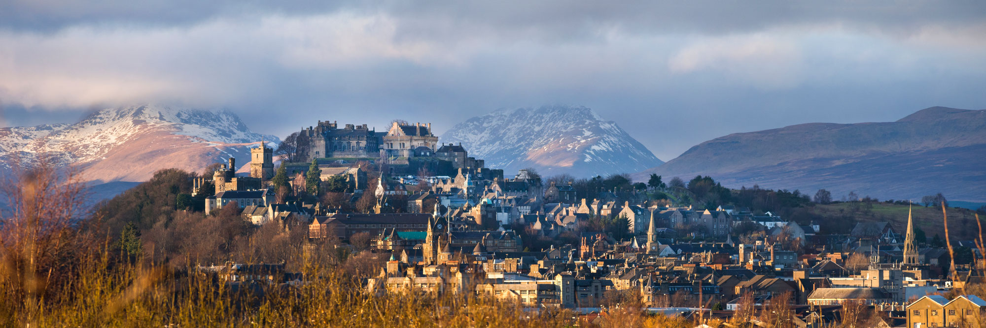 A view across Stirling to the castle at sunset