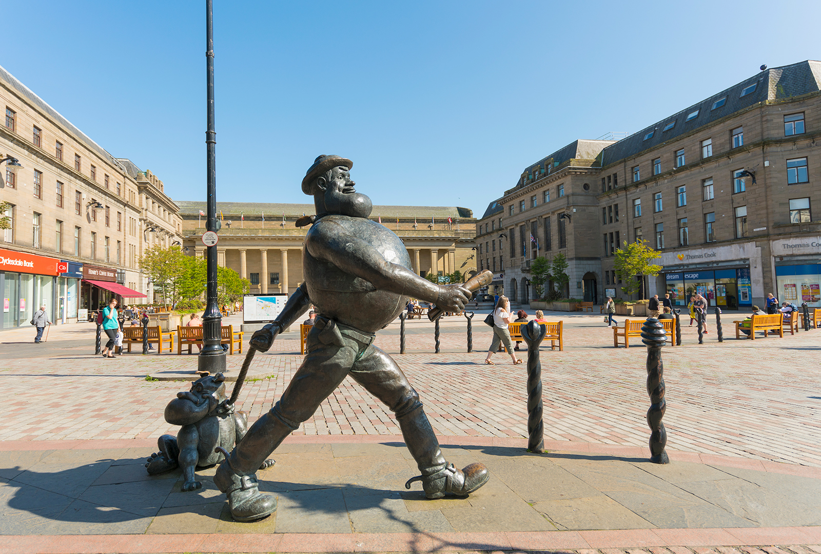 A brownze statue of Beano character Desperate Dane in City Square, Dundee.